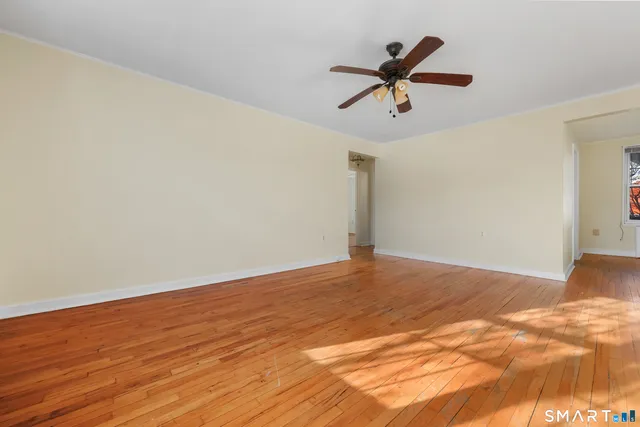 a view of a ceiling fan with wooden floor