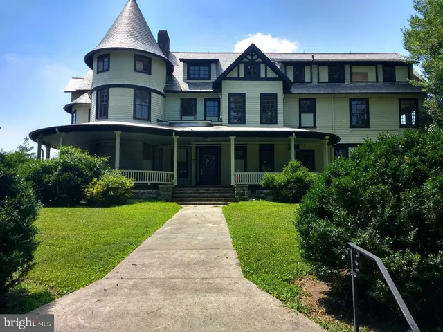 a front view of a house with yard