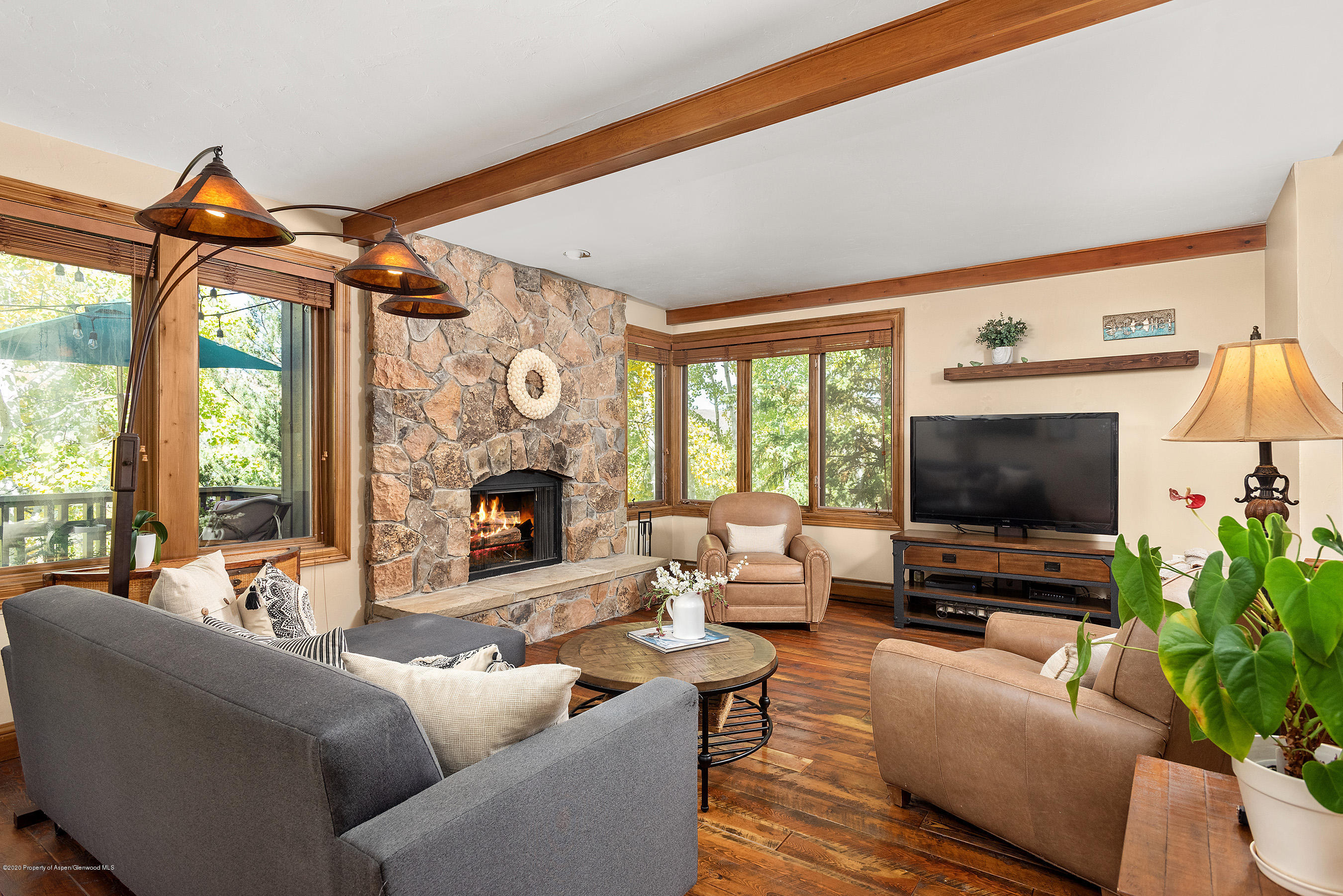 a living room with furniture and a flat screen tv