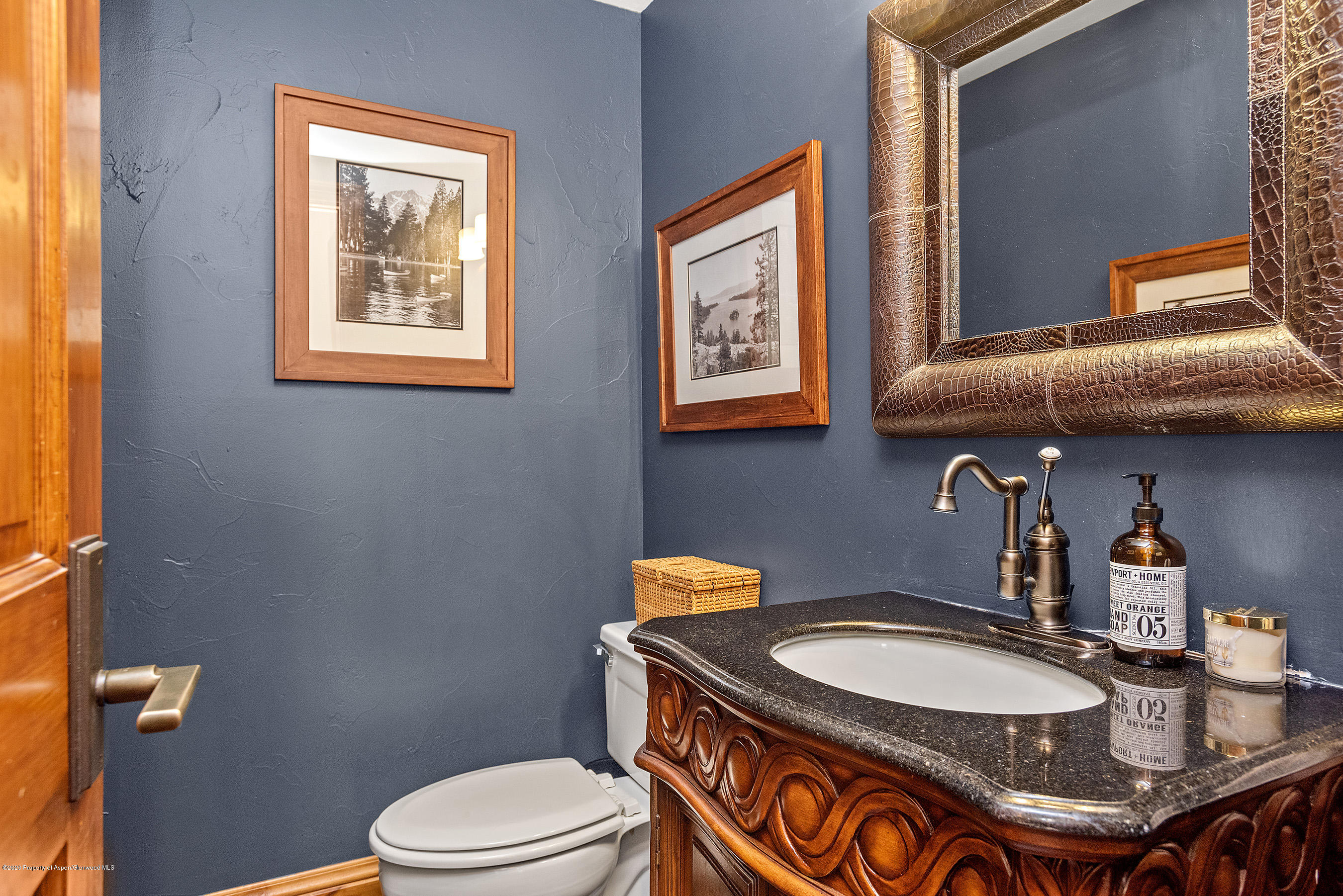222 Meadow Ranch Road, Unit D4B Snowmass Village, CO 81615 - Photo 12 of 26 a bathroom with a toilet a sink and mirror