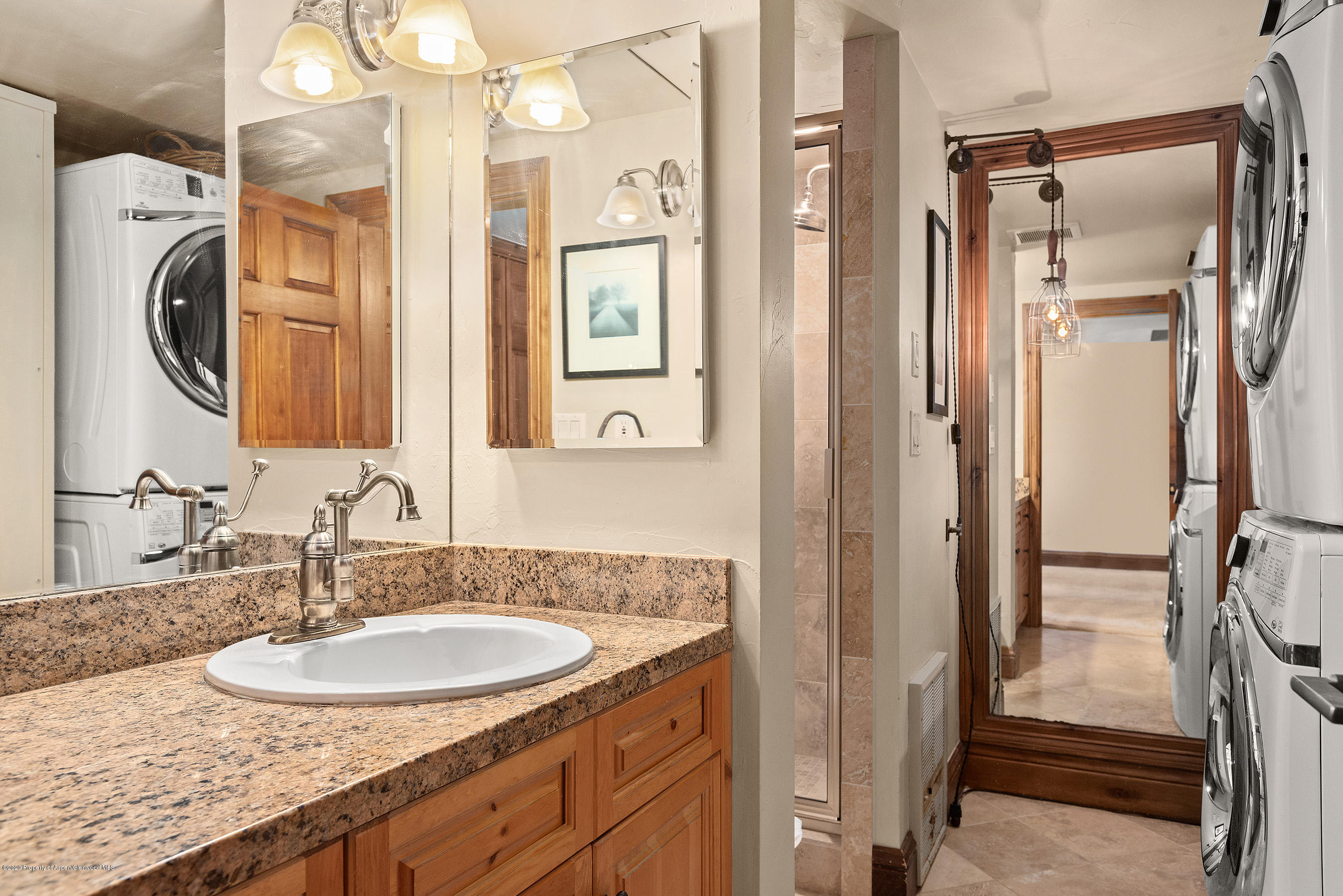 222 Meadow Ranch Road, Unit D4B Snowmass Village, CO 81615 - Photo 17 of 26 a bathroom with a sink vanity granite and a mirror
