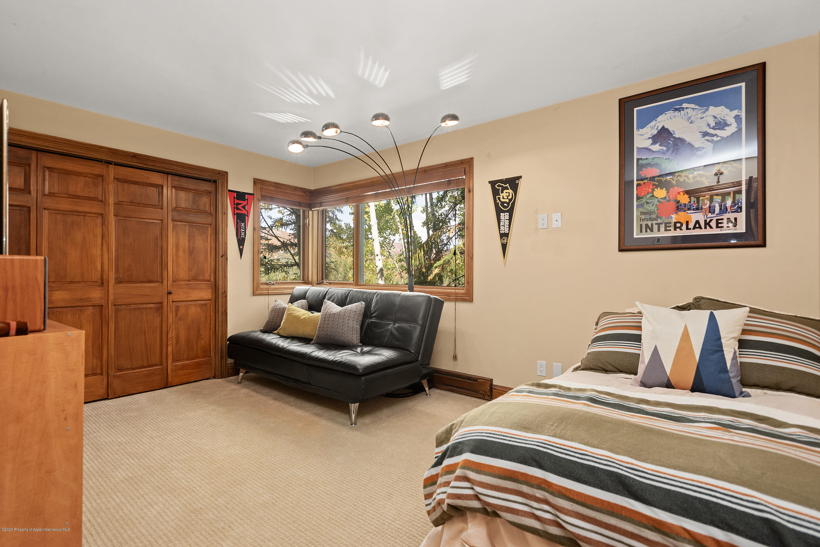 222 Meadow Ranch Road, Unit D4B Snowmass Village, CO 81615 - Photo 9 of 26 a bedroom with furniture and a window