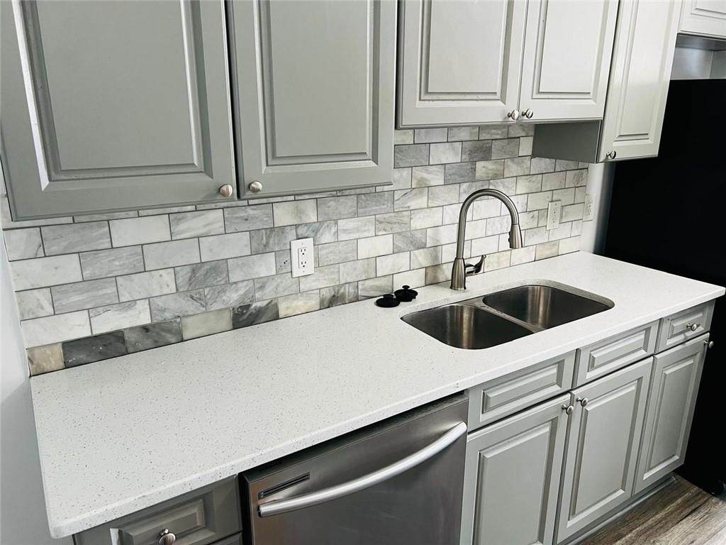 3759 Mulkey Circle Southwest Marietta, GA 30008 - Photo 15 of 22 a kitchen with a sink and cabinets