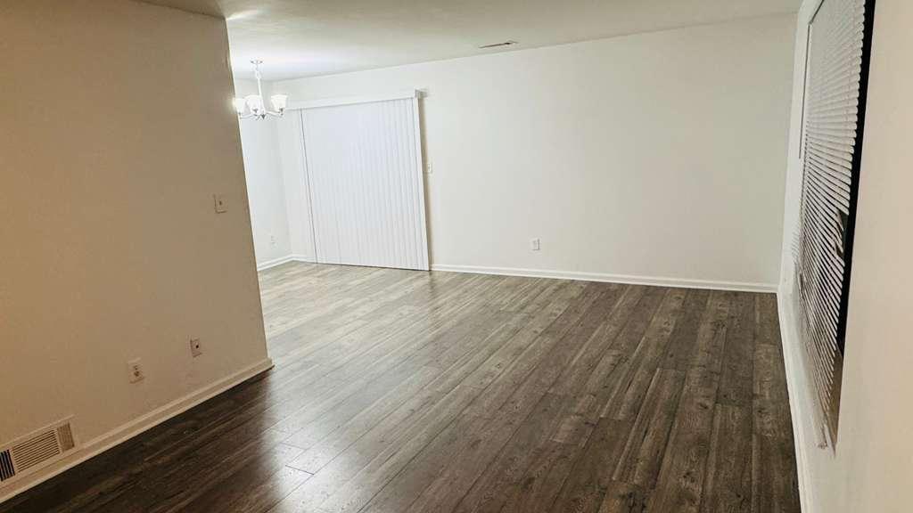3759 Mulkey Circle Southwest Marietta, GA 30008 - Photo 18 of 22 an empty room with wooden floor