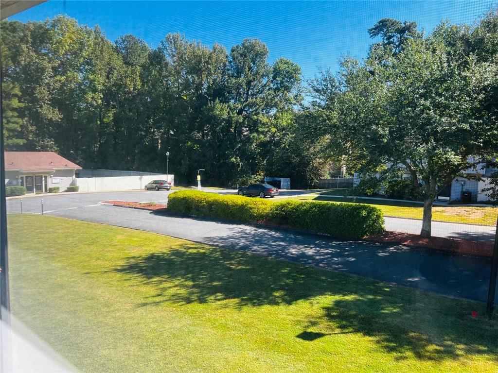 3759 Mulkey Circle Southwest Marietta, GA 30008 - Photo 21 of 22 a view of a swimming pool with an outdoor space and seating area