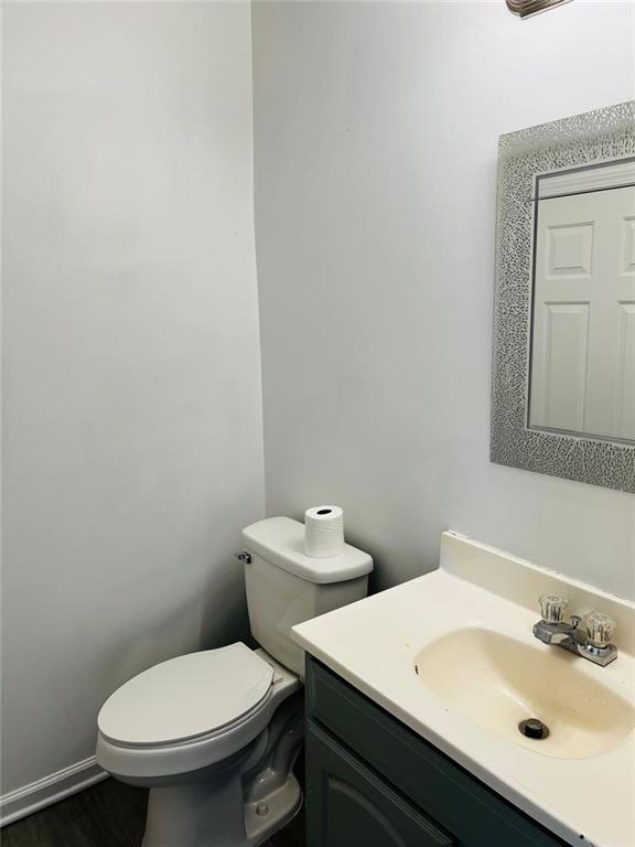 3759 Mulkey Circle Southwest Marietta, GA 30008 - Photo 5 of 22 a white toilet sitting next to a bathroom sink