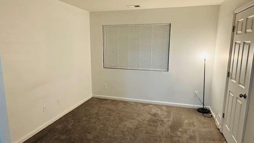 3759 Mulkey Circle Southwest Marietta, GA 30008 - Photo 7 of 22 an empty room with a door