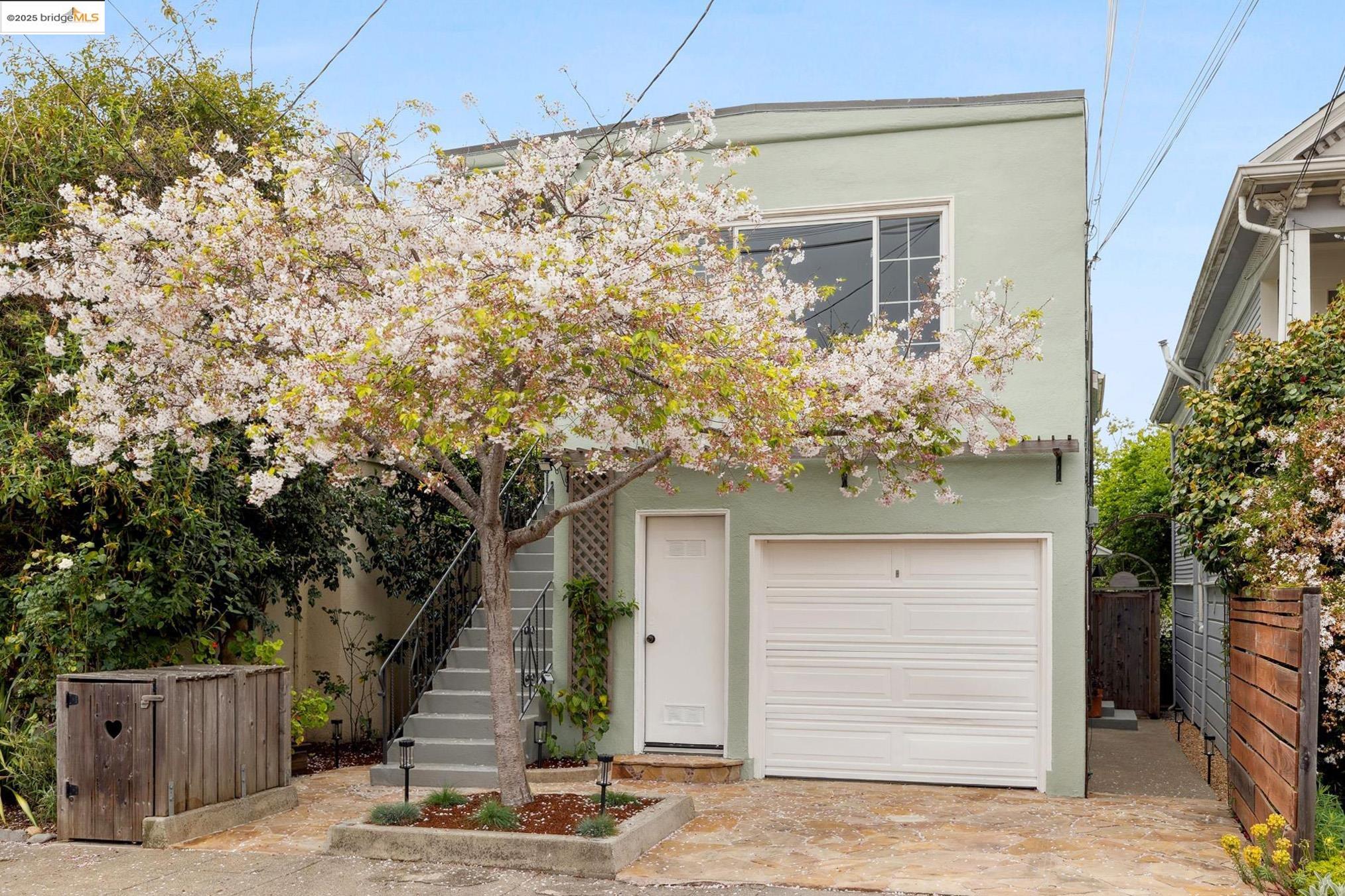 a house that has a tree in front of the house