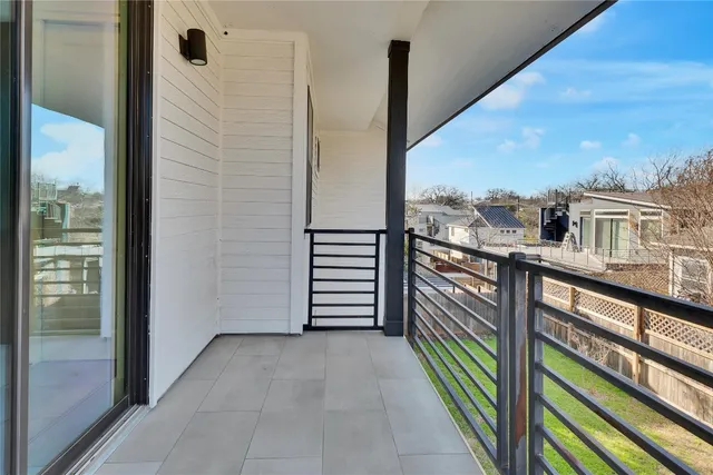 a view of a balcony with city view