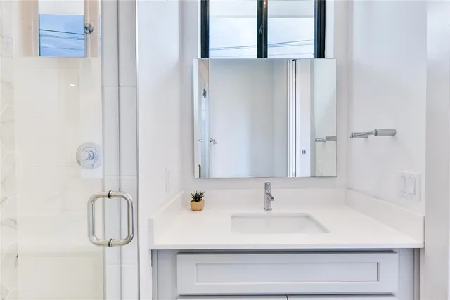 a bathroom with a sink and a mirror
