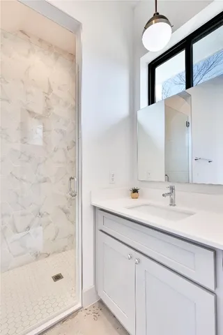 a bathroom with a sink and a mirror