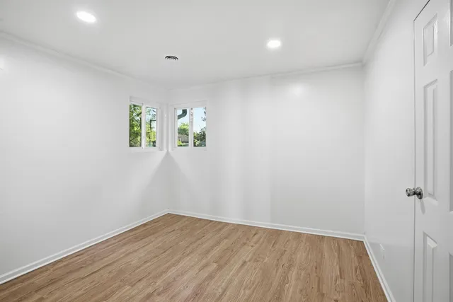 a view of room with window and hardwood floor
