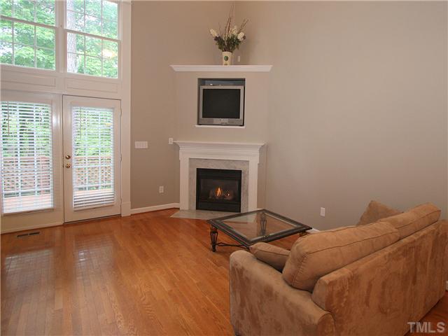 5302 Goldenglow Way Raleigh, NC 27606 - Photo 3 of 24 a living room with furniture and a fireplace