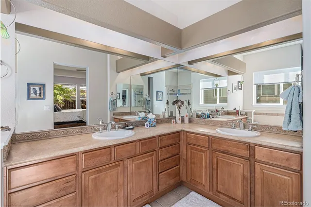 a bathroom with a sink and mirror