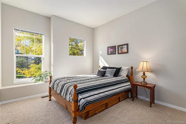 a bedroom with bed and a window