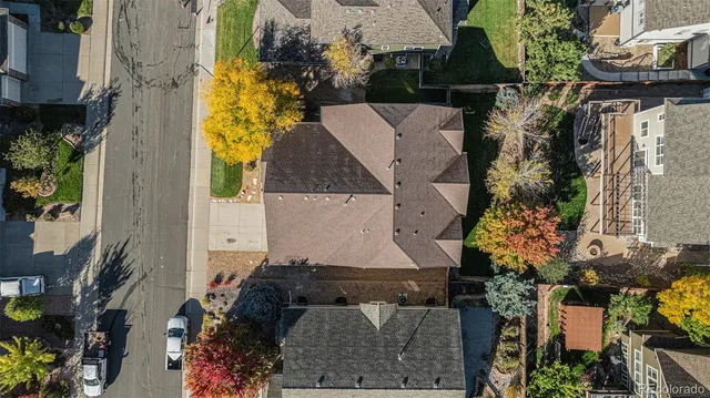 an aerial view of a house with a yard