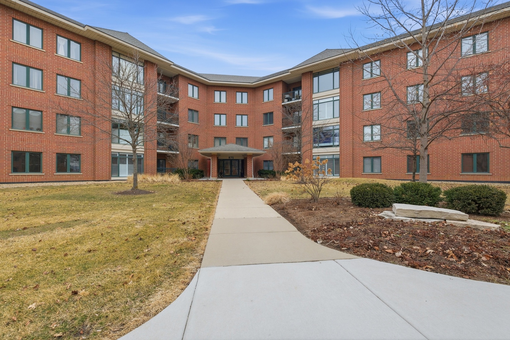 875 East 22nd Street, Unit 410 Lombard, IL 60148 - Photo 1 of 30 a front view of a building