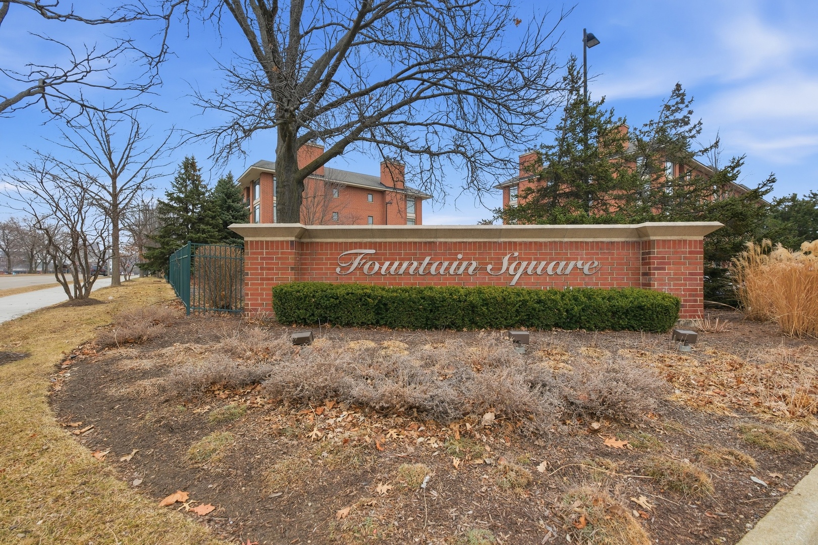 875 East 22nd Street, Unit 410 Lombard, IL 60148 - Photo 2 of 30 a front view of a house with a yard and garage