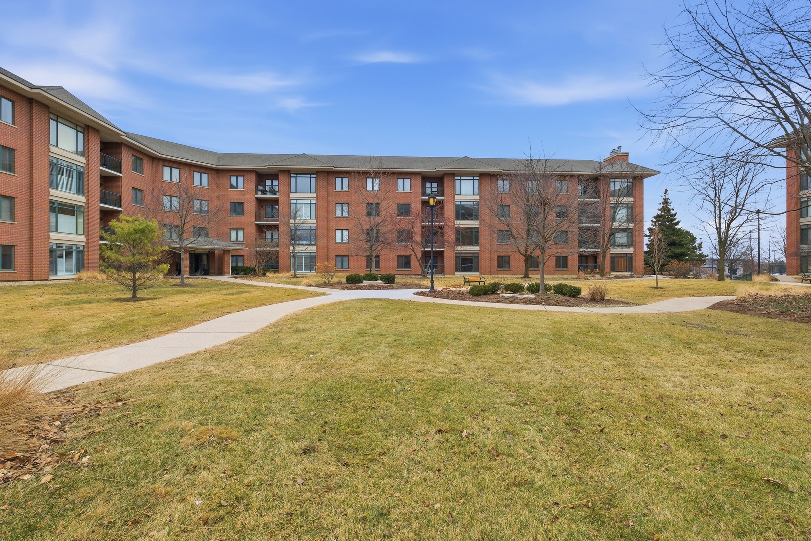 875 East 22nd Street, Unit 410 Lombard, IL 60148 - Photo 27 of 30 a house view with swimming pool in front of it