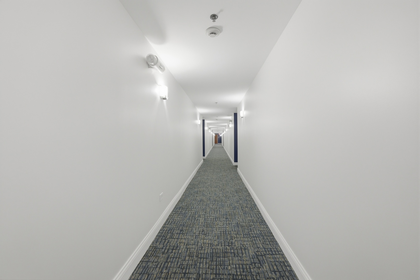 875 East 22nd Street, Unit 410 Lombard, IL 60148 - Photo 4 of 30 a view of a hallway with a white walls