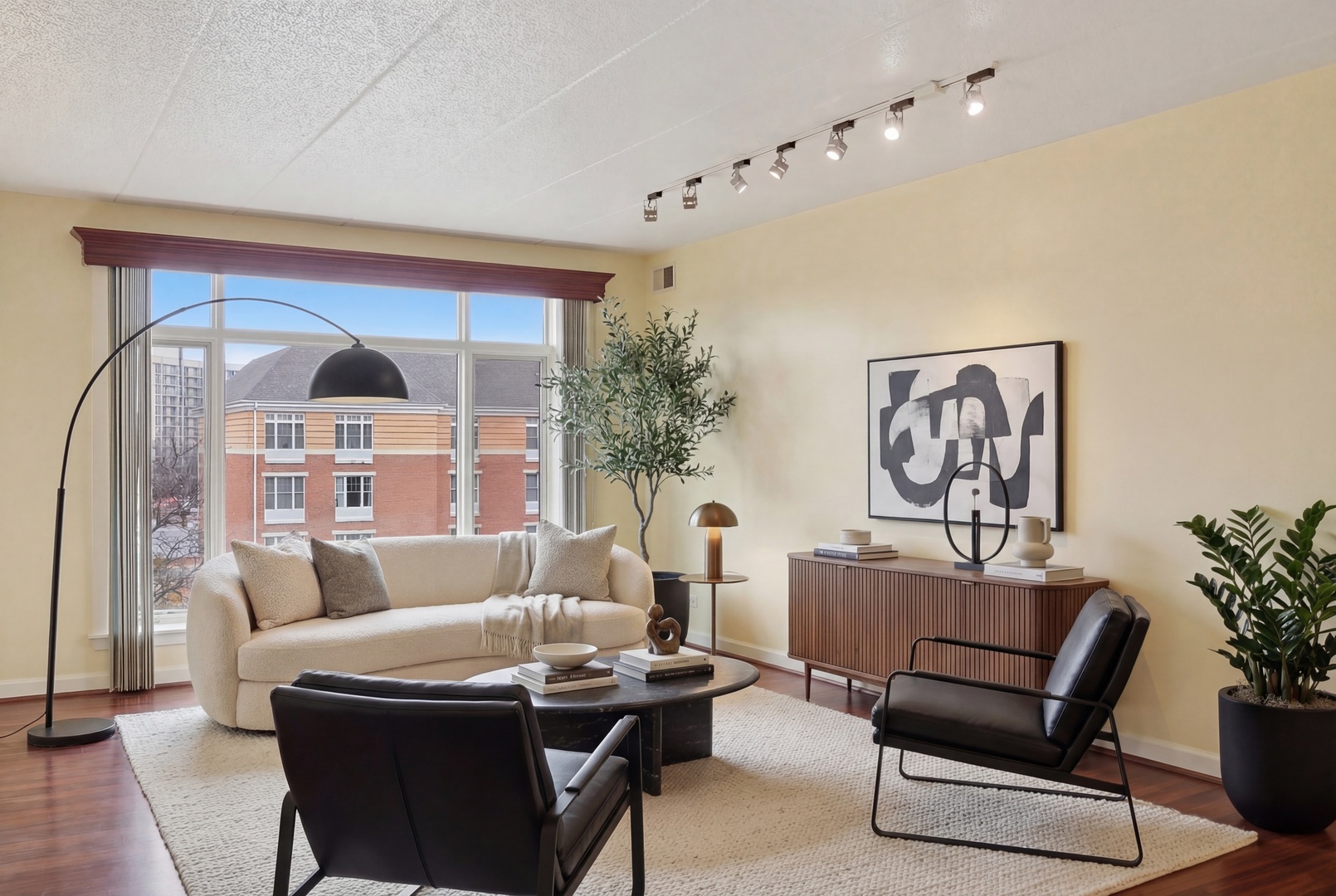 875 East 22nd Street, Unit 410 Lombard, IL 60148 - Photo 6 of 30 a living room with furniture and a chandelier