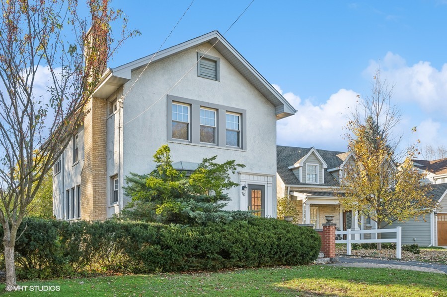 76 Warwick Road Winnetka, IL 60093 - Photo 2 of 8 a front view of a house with a yard
