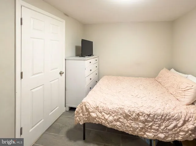 a large white bed in a white room