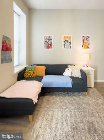 a bedroom with a bed and a couch