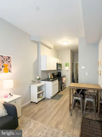 a kitchen with a table and chairs in it
