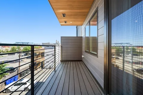 a view of balcony with wooden floor
