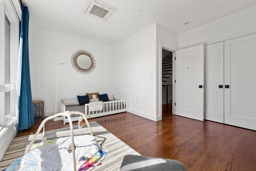 7 A Kemble Place Boston, MA 02127 - Photo 21 of 26 a living room with furniture and wooden floor