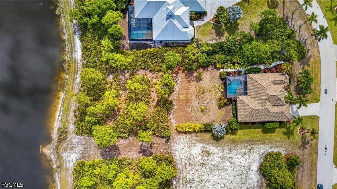 6109 Calusa Rdg Trail Bokeelia, FL 33922 - Photo 44 of 48 an aerial view of a house with a yard