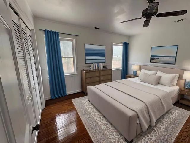 a bedroom with a bed and a window