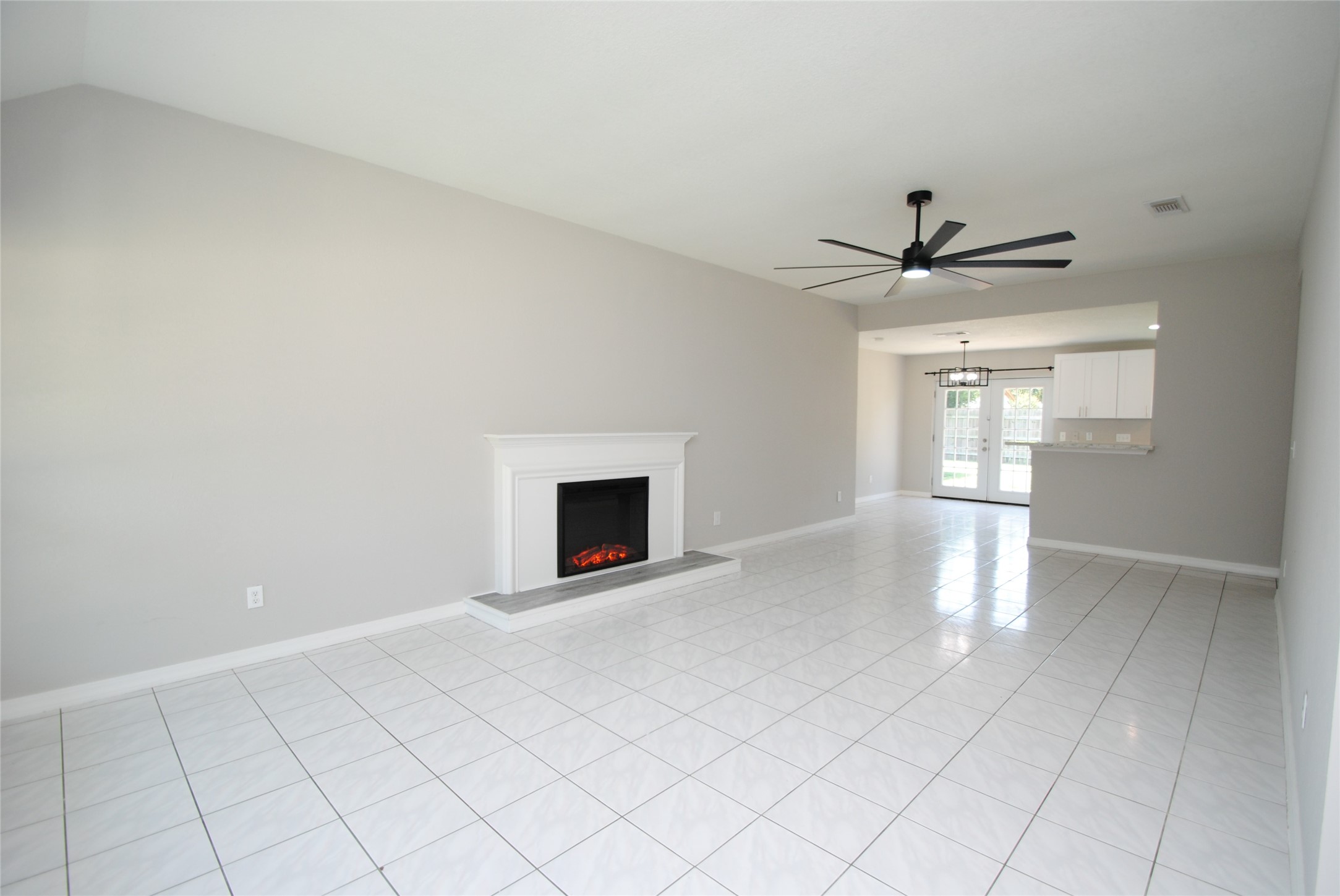 22831 John Rolfe Lane Katy, TX 77449 - Photo 8 of 34 a view of an empty room with a fireplace and a window