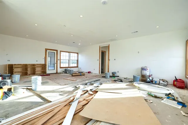 a view of a living room filled with furniture