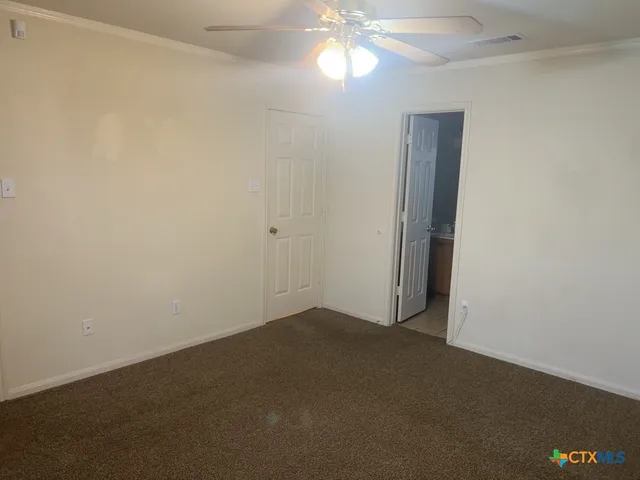 an empty room with a bathroom