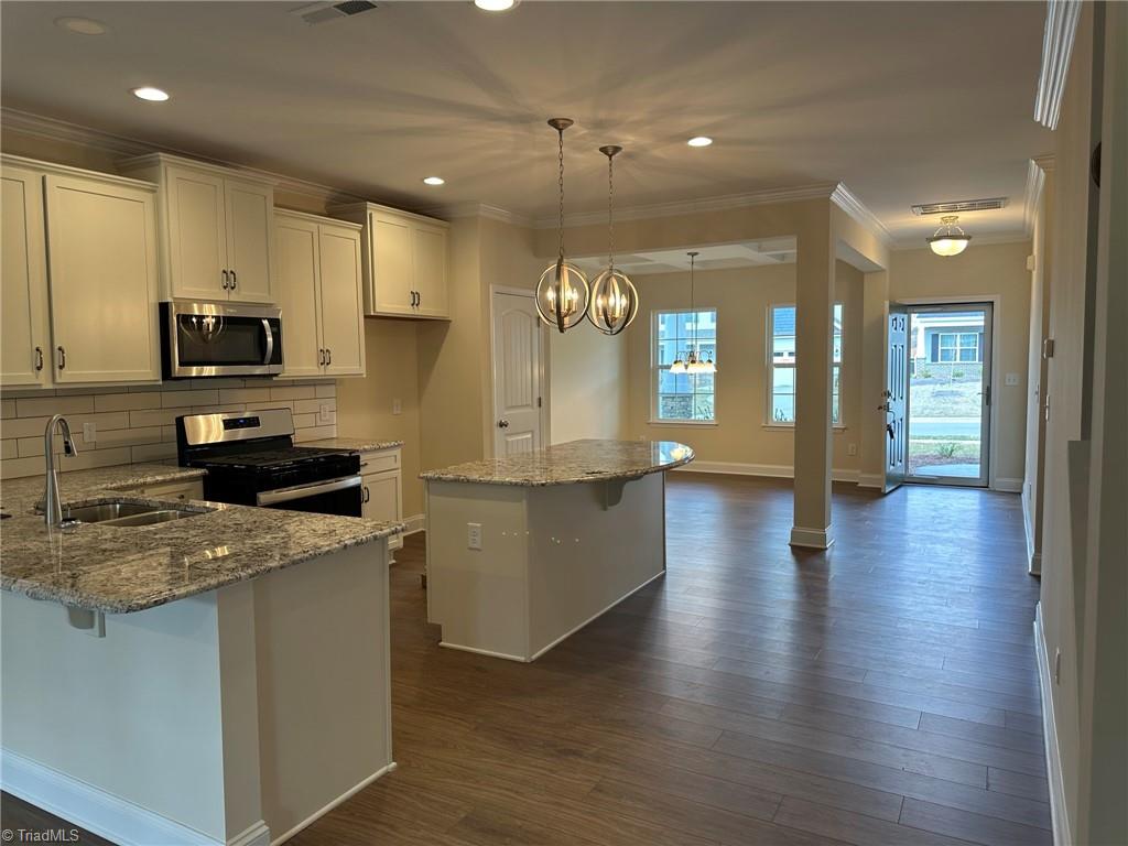 3248 Alyssa Way High Point, NC 27265 - Photo 6 of 34 Open kitchen w backsplash & island