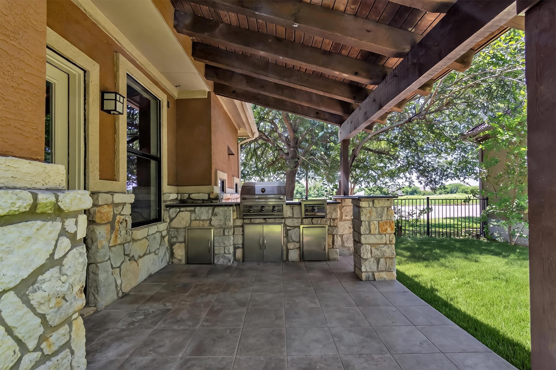 1010 Immanuel Road, Unit 103 Pflugerville, TX 78660 - Photo 28 of 30 An inviting outdoor kitchen area with a built-in grill offers an ideal setting for al fresco entertaining.