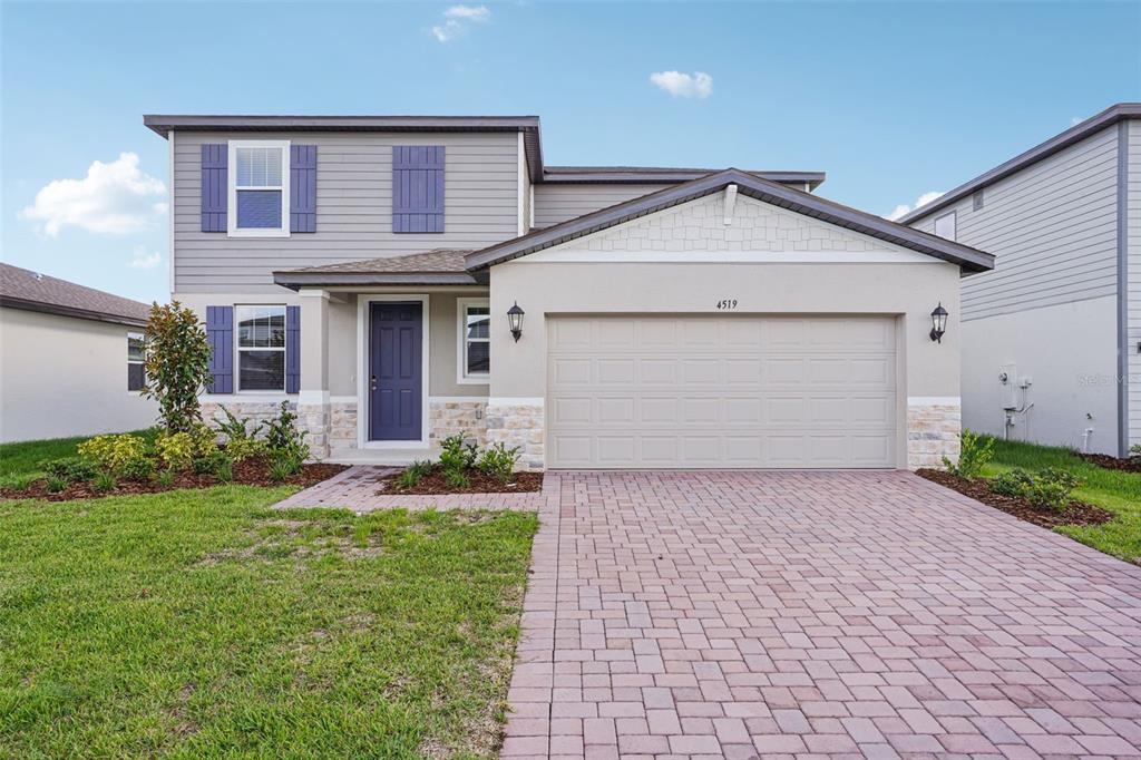 4519 Windy Oak Way St. Cloud, FL 34772 - Photo 1 of 40 a view of a house with yard and plants