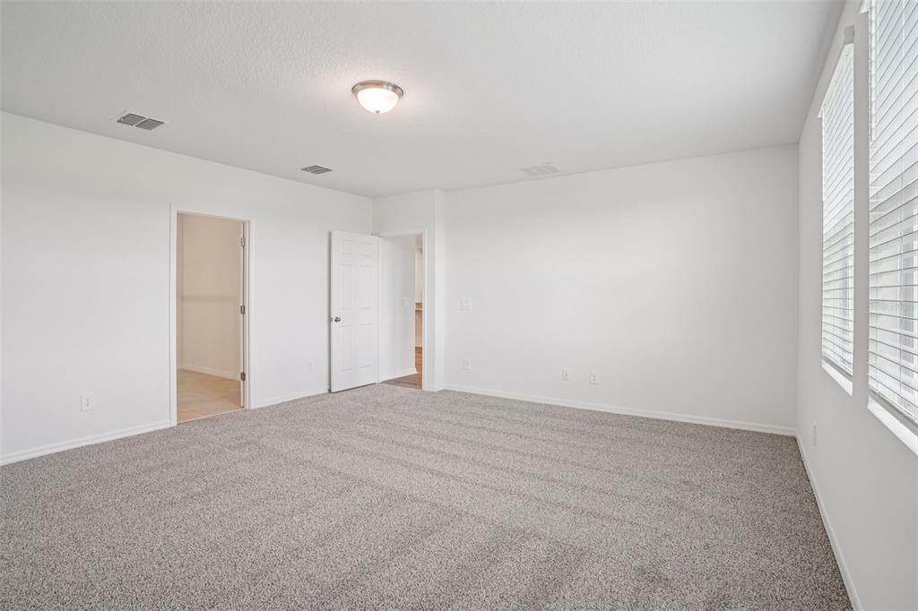 4519 Windy Oak Way St. Cloud, FL 34772 - Photo 17 of 40 a view of an empty room with a window