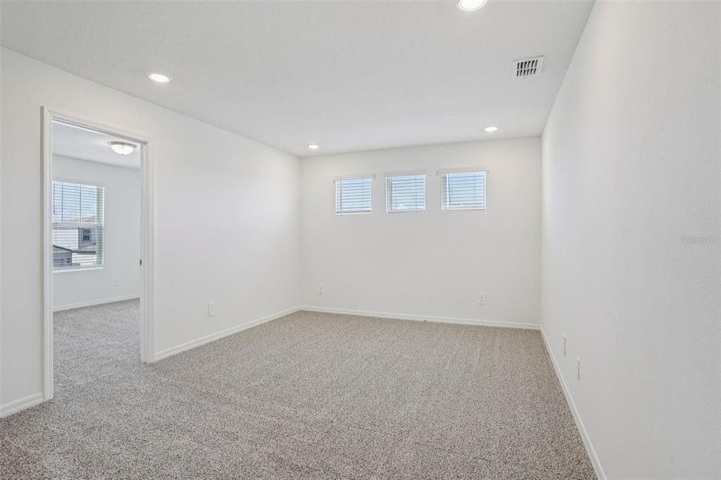 4519 Windy Oak Way St. Cloud, FL 34772 - Photo 22 of 40 an empty room with a empty space and windows