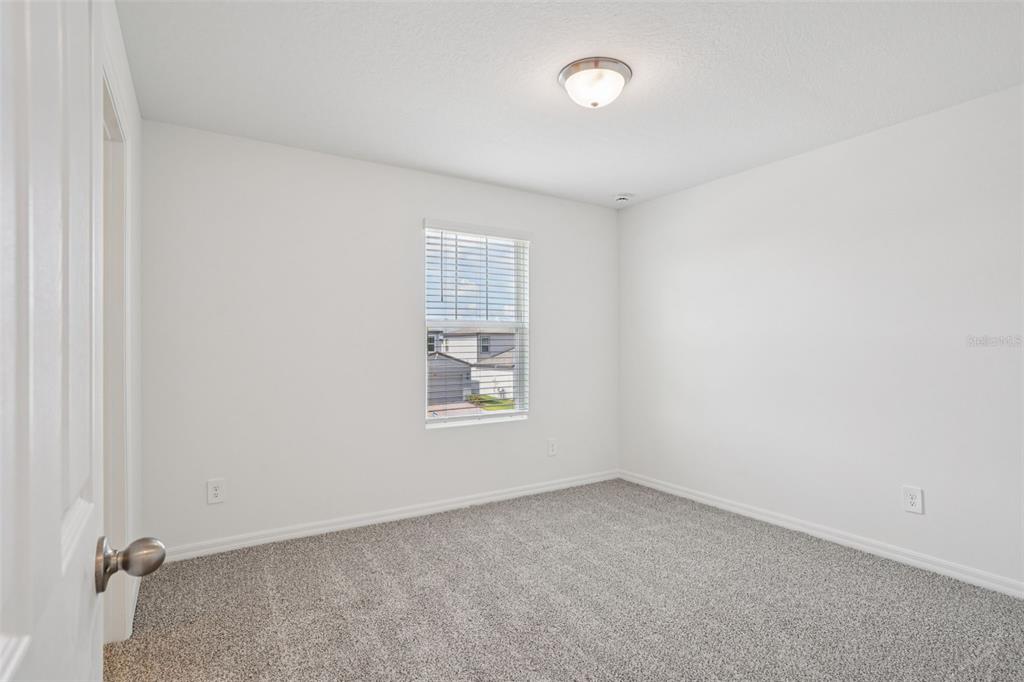 4519 Windy Oak Way St. Cloud, FL 34772 - Photo 25 of 40 an empty room with a window