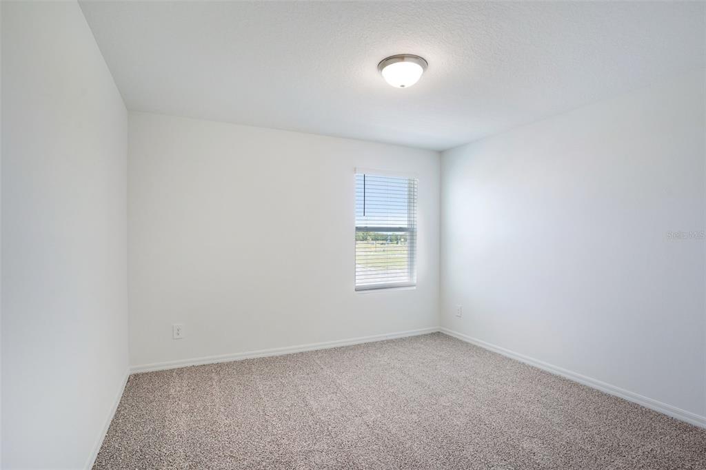 4519 Windy Oak Way St. Cloud, FL 34772 - Photo 29 of 40 an empty room with a window