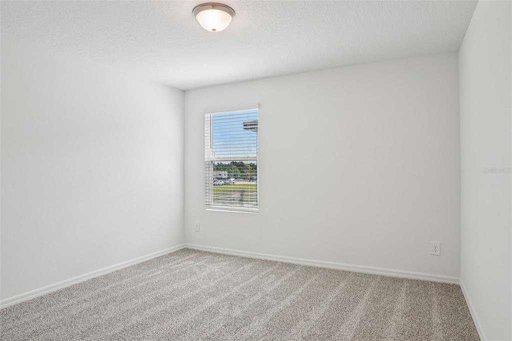 4519 Windy Oak Way St. Cloud, FL 34772 - Photo 33 of 40 an empty room with a window
