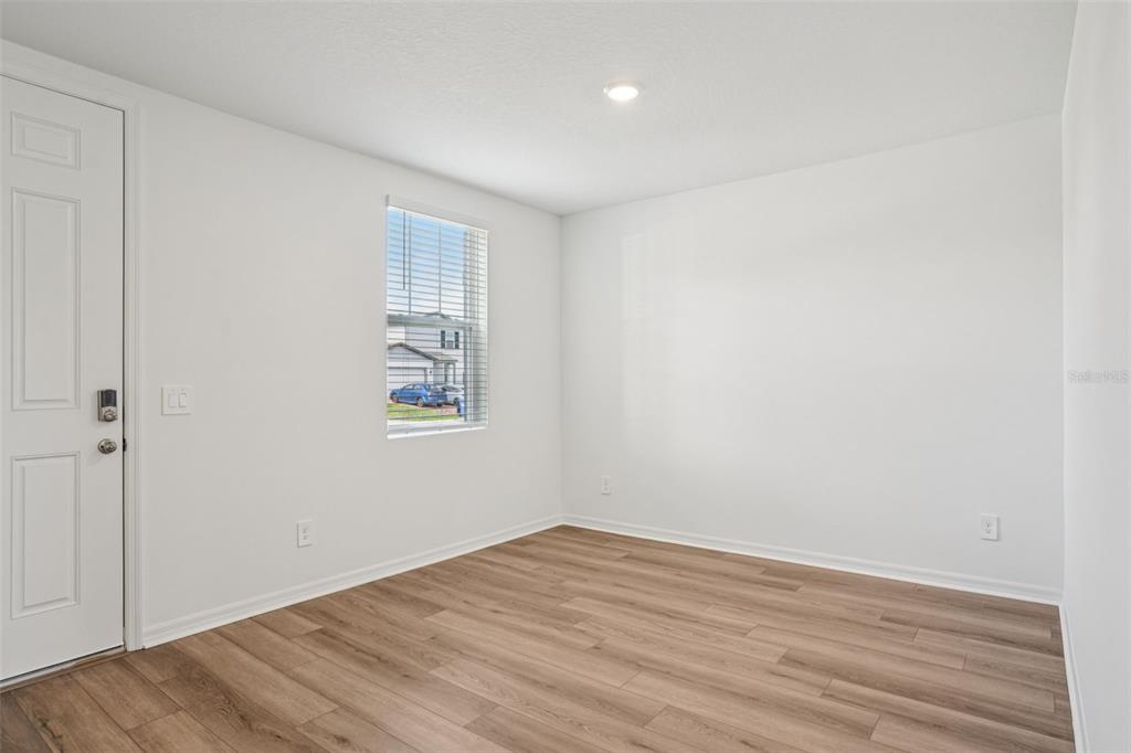 4519 Windy Oak Way St. Cloud, FL 34772 - Photo 5 of 40 wooden floor in an empty room