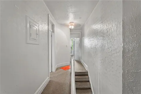 a bathroom with a mirror and a shower