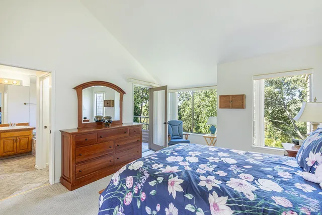 a bed room with a bed and a dresser