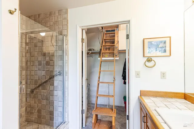 a bathroom with a shower and a sink