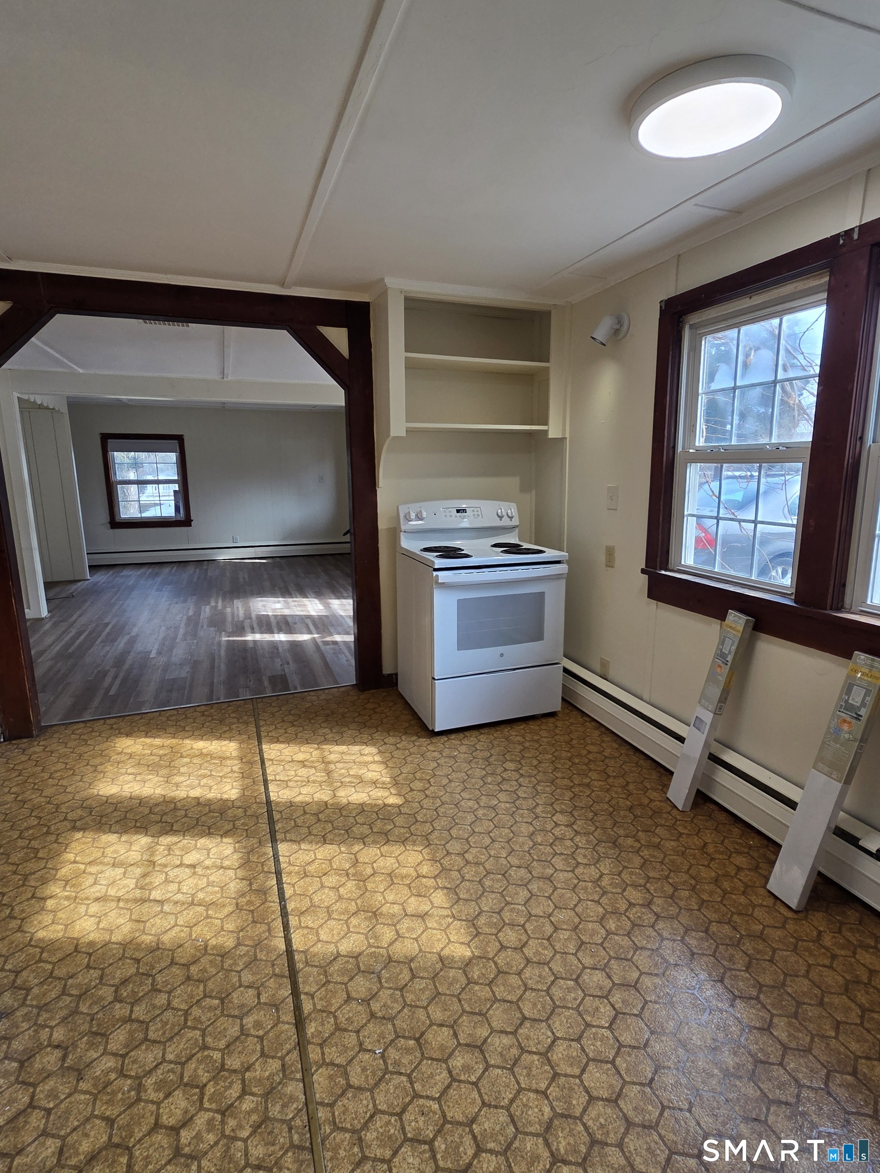 397 Buddington Road Groton, CT 06340 - Photo 9 of 13 a living room with fireplace furniture and a window