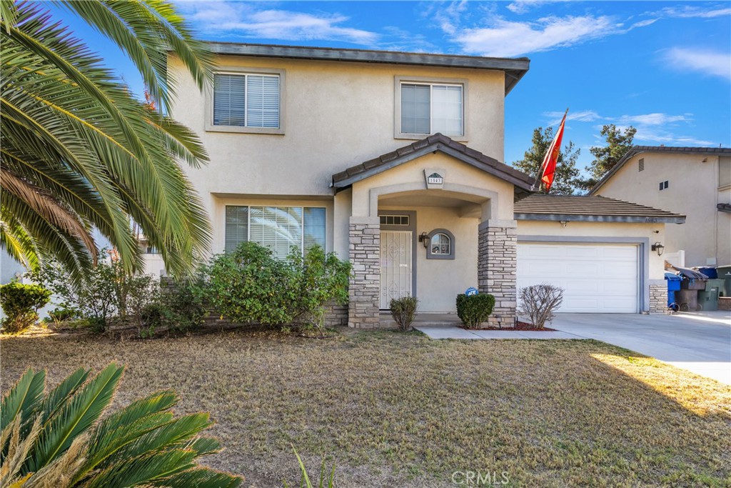 1543 MacIntosh Drive Riverside, CA 92507 - Photo 1 of 1 a front view of a house with garden
